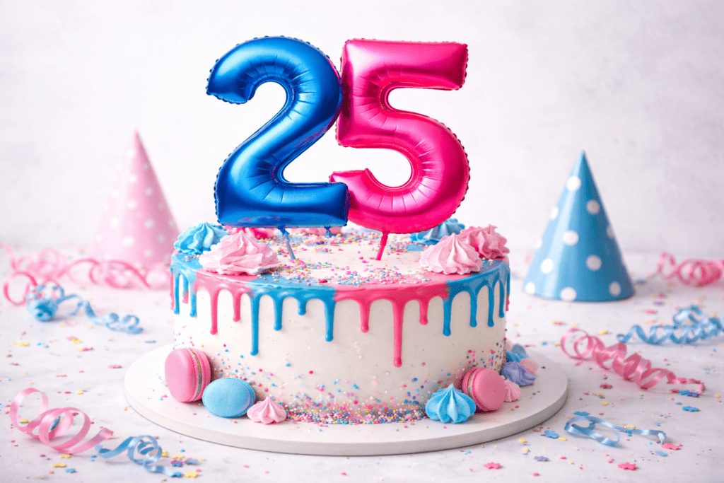 Festive birthday cake with blue and pink "25" candles, colorful sprinkles, and party hats, celebrating 25 years of Ardentis dental care.