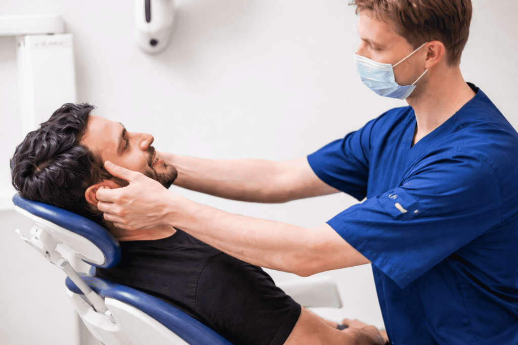 Dental examination, healthcare, patient care, medical professional, dental clinic, oral health, dental check-up, healthcare provider, patient treatment, dental care.