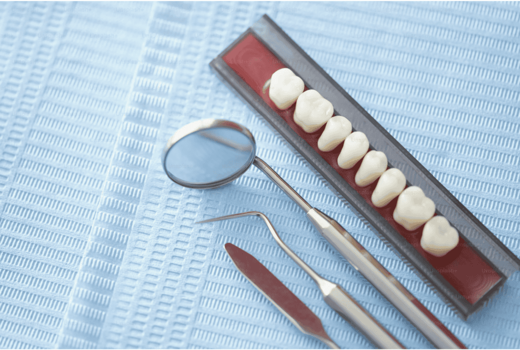 Precise dental tools and teeth model for dental procedures and patient care.