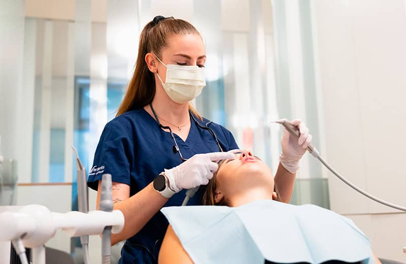 Dental treatment procedure at Ardentis dental clinic, professional dentist performing oral care.